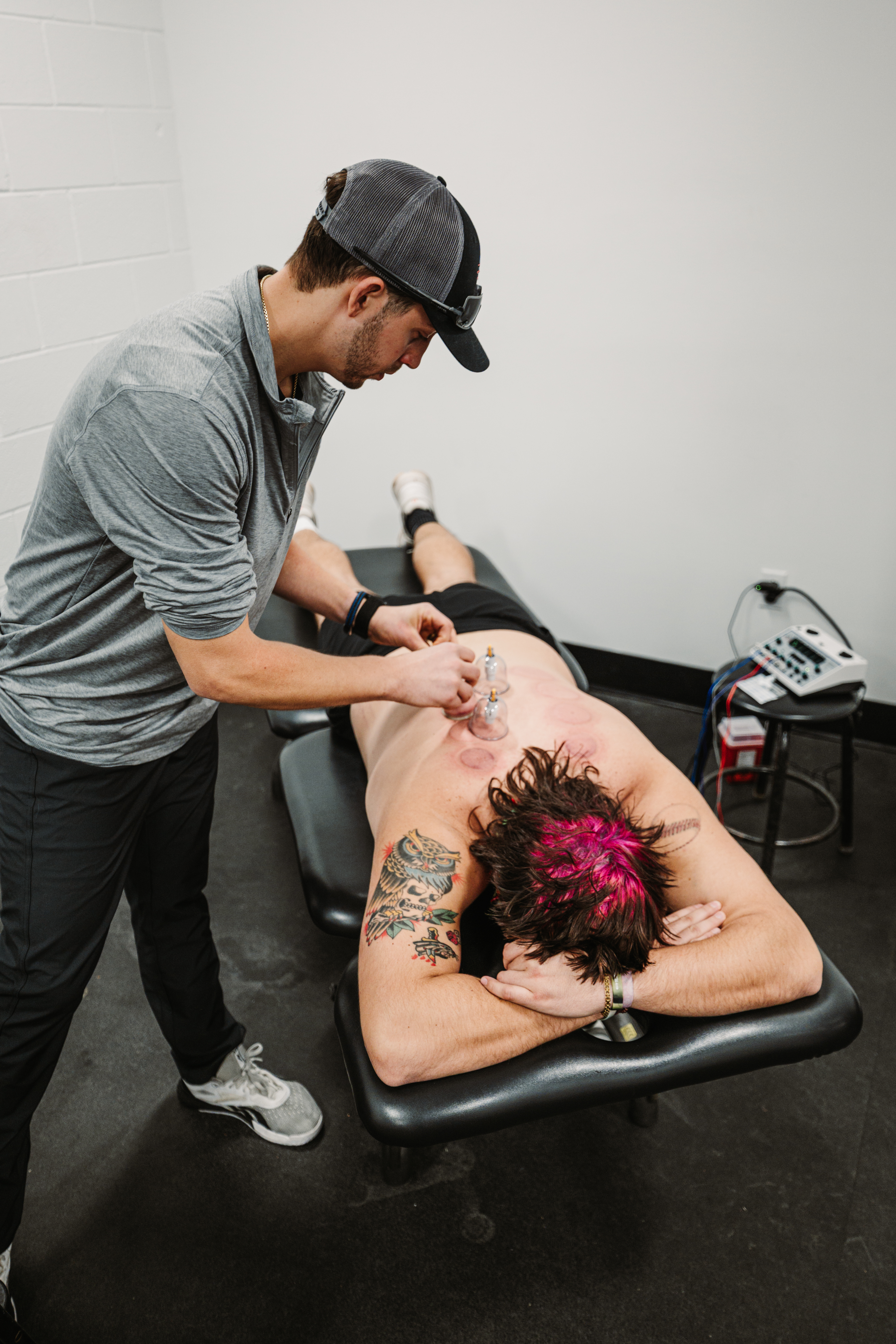 Dr. Kostello performing cupping therapy