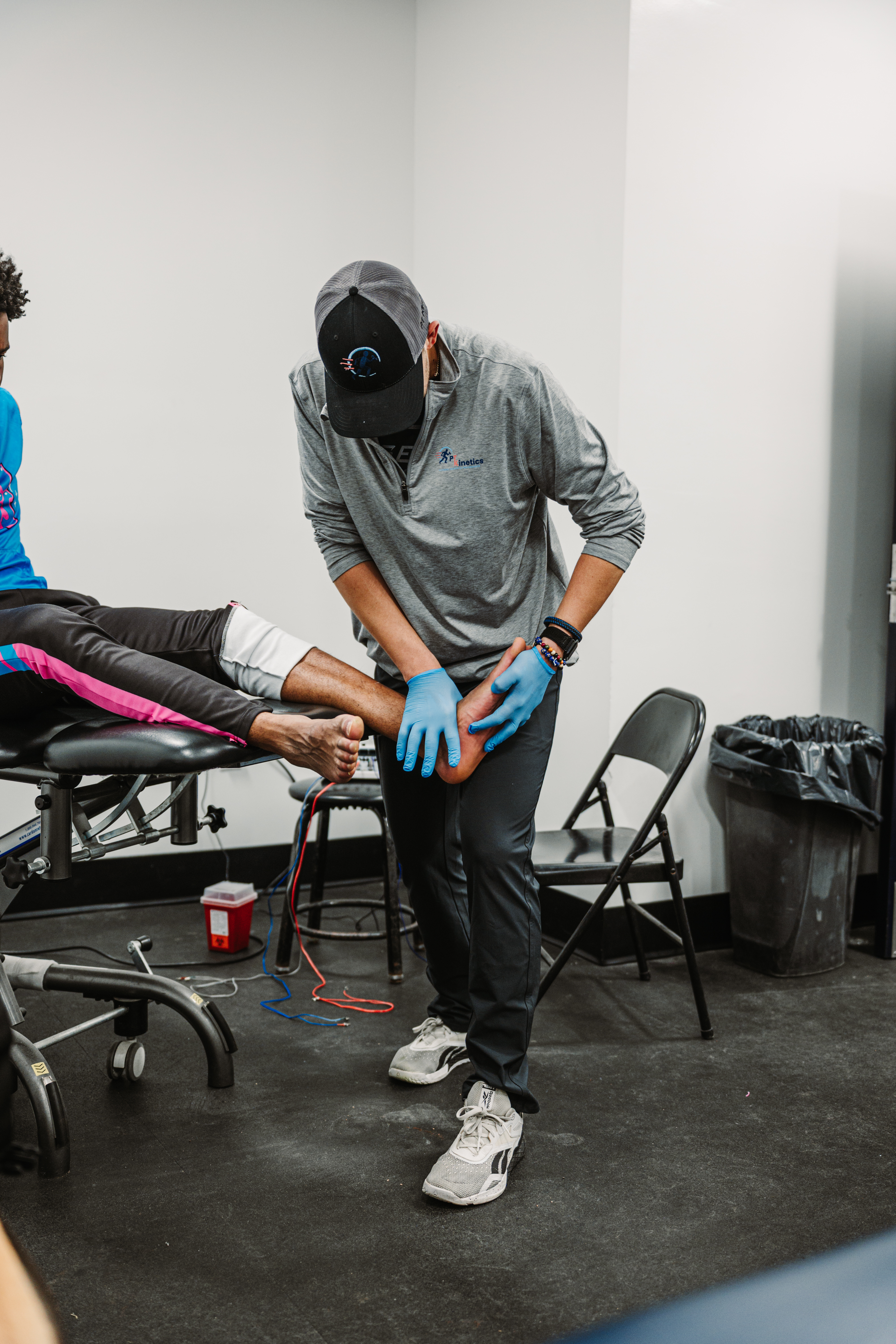 Dr. Kostello working with a patient