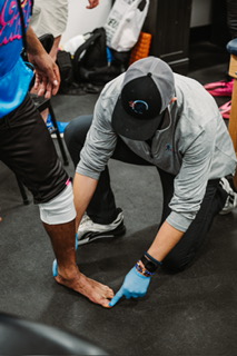 Dr. Kostello working with a patient